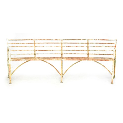 471 - A white painted Regency style curved garden bench, 250cm wide

Provenance: from the estate of the la... 