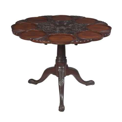 394 - A carved mahogany supper tripod table in George II Irish style, late 19th or early 20th century, the... 