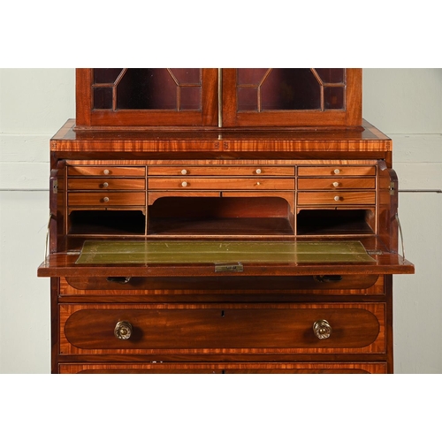 421 - A mahogany and cross banded bureau bookcase c.1820 and later, with astragal glazing above a secretai... 