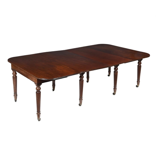 425 - A George IV mahogany extending dining table, c.1825, the draw action with two additional leaf insert... 