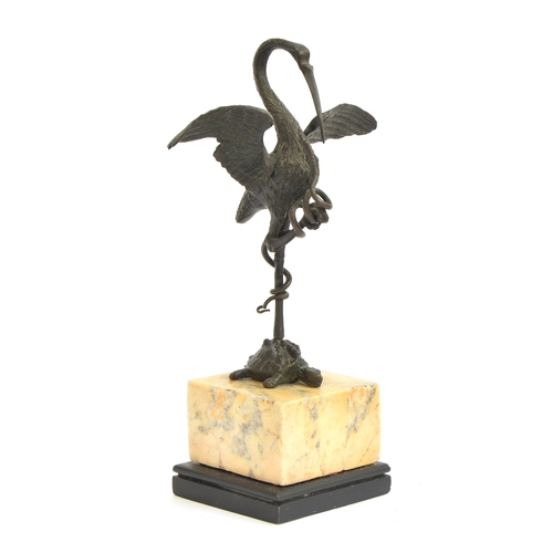 123 - An early 20th century bronze sculpture in the form of a crane standing atop a tortoise holding a sna... 