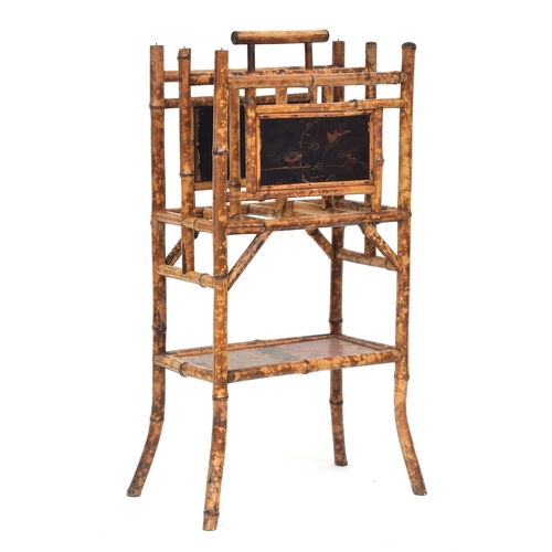 433 - A late 19th century tiger bamboo standing magazine rack, with lacquered panels, 41cm wide, 84cm high