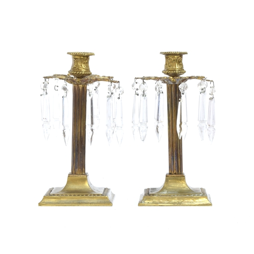 336 - A pair of late Victorian gilt metal lustre candlesticks with cut glass drops, bears Rd. no. to base,... 