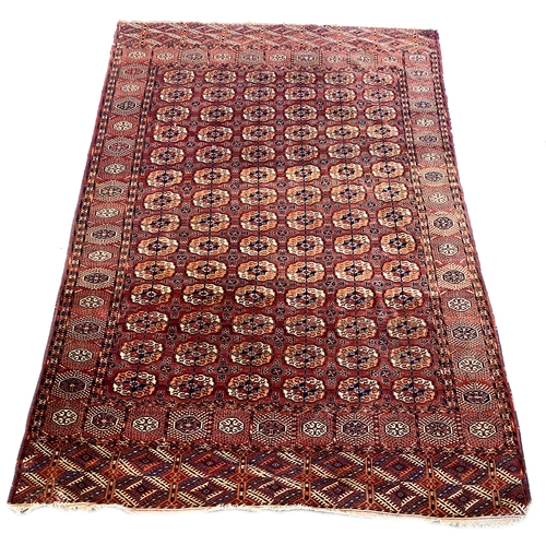 487 - A red ground tekke Turkman rug, 375x240cm