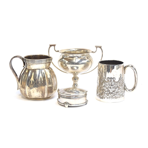 61 - A silver milk jug by Edward Barnard & Sons Ltd, London 1904; together with a small chased silver mug... 