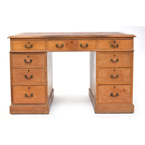 437 - An early 20th century oak partner's desk, the tooled red leather skiver (AF), over the traditional a... 