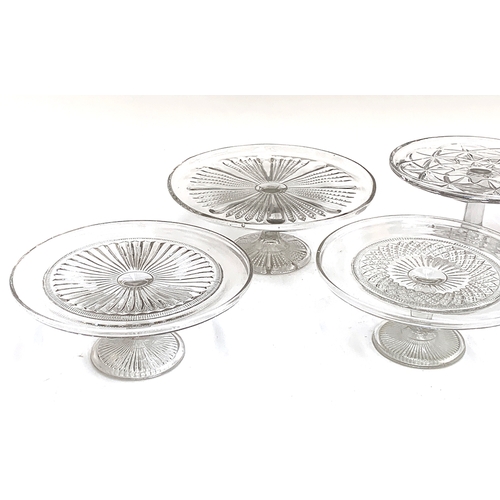 246 - A collection of seven late 19th and early 20th century  moulded glass tazza dishes/cake stands, the ... 