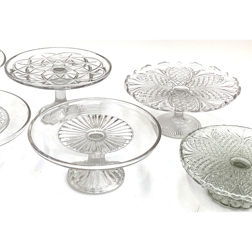 246 - A collection of seven late 19th and early 20th century  moulded glass tazza dishes/cake stands, the ... 