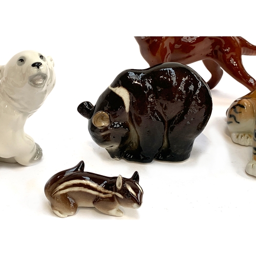 252 - A collection of animal figurines, to include USSR Lomonosov bear, tiger, chipmunk and polar bear, Tr... 