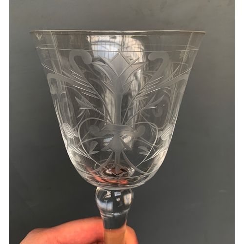 504 - A set of six hand blown wine glasses with scrolling engraved detail, 20cmH