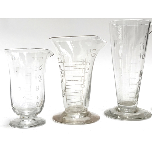 268 - A quantity of antique and vintage measuring glasses, the tallest 15cmH, to include three Victorian e... 