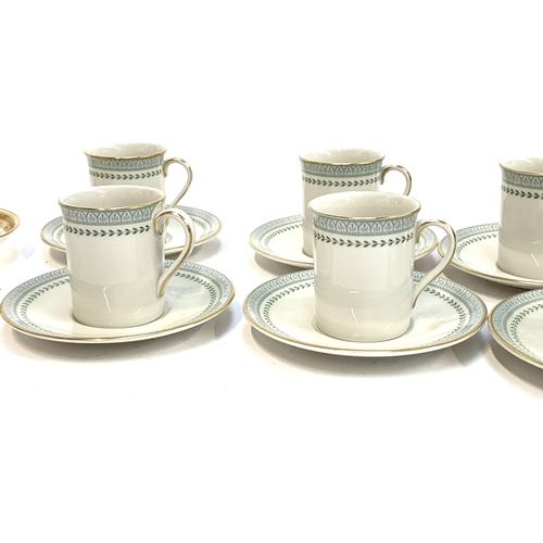 278 - A set of five smart early 20th century Cauldon coffee cans and saucers with gilt greek key pattern; ... 