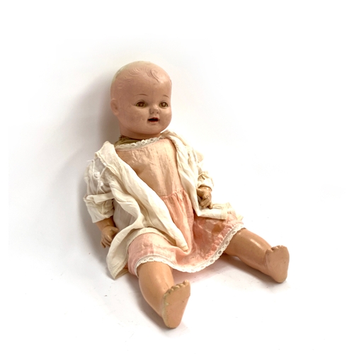 428 - A vintage 'Petite' doll, 60cmL