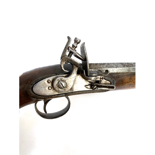 439 - An early 19th century flintlock holster pistol with 21.5 octagonal barrel, walnut full stock, plain ... 