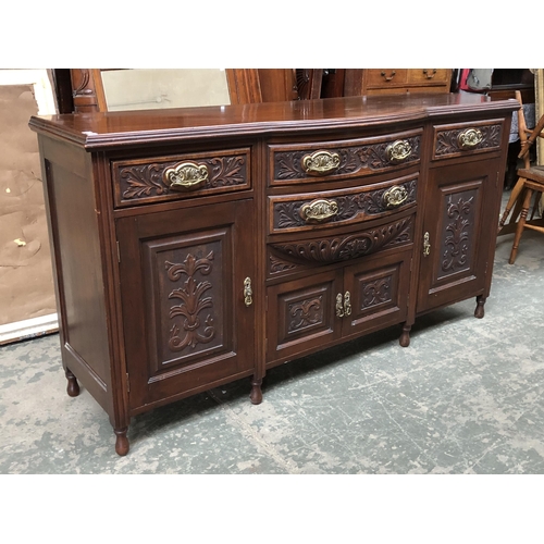 1196 - A large sideboard of two drawers over two doors, flanked by a further drawer over cupboard, 181cmW