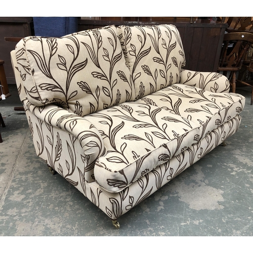 1220 - A good modern country house two seater sofa on turned and brass casters, approx. 153cmW