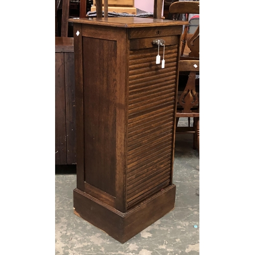 1244 - An oak tambour fronted cabinet, 50x43x116cmH