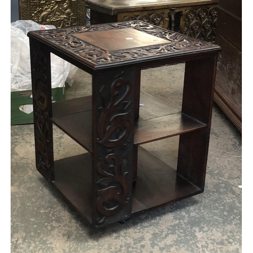 1211 - A carved 20th century rotating bookshelf, 50x50x62cmH