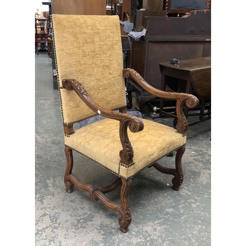 1230 - A continental throne chair, with upholstered back and seats and acanthus arms, 64cmW