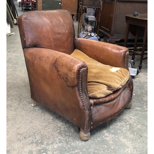 1237 - A leather club chair in as found condition