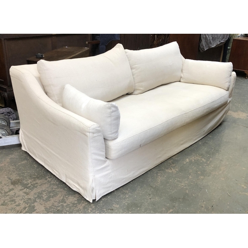 1239 - A modern three seater sofa upholstered in an off-white fabric, 215cmW 106cmD