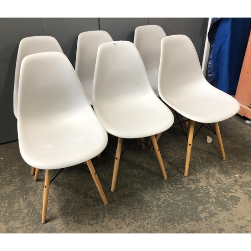 1255 - A set of six dining chairs by MMilo