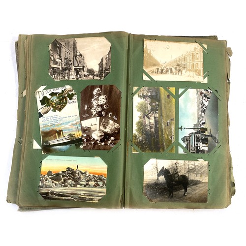 652 - BOOKS. A very old postcard album (the album rather average condition but the cards generally good or... 