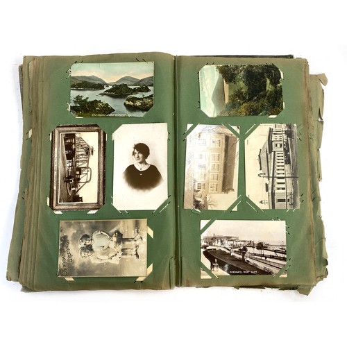 652 - BOOKS. A very old postcard album (the album rather average condition but the cards generally good or... 