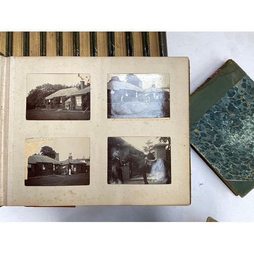 549 - A collection of 12 early 20th century quarter leatherbound photo albums, presumably privately bound ... 