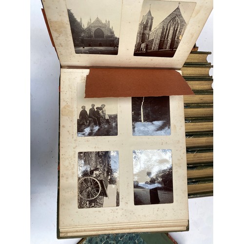 549 - A collection of 12 early 20th century quarter leatherbound photo albums, presumably privately bound ... 