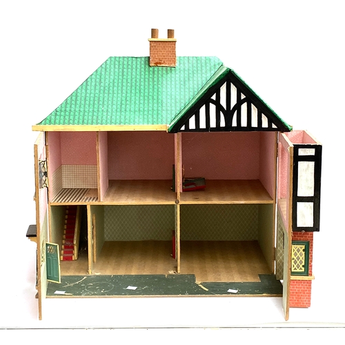 552 - A dolls house in mock tudor style, 65cmW