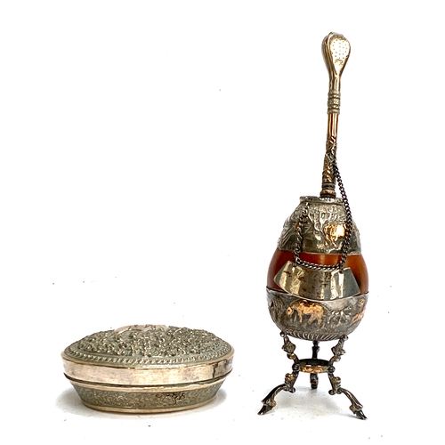 153 - An Argentinian bombilla and criollo, stamped 925 silver; together with a white metal chased lidded p... 