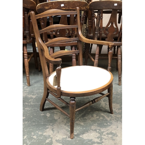 1218 - An Edwardian mahogany open armchair