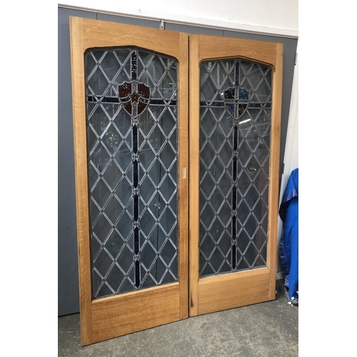 1262 - A set of four oak and lead glazed doors, each 74x200cm