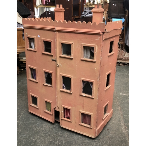 1263 - A large Victorian dolls house, painted pink, opening to five rooms, 92cm wide