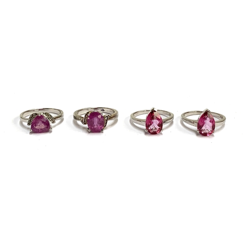 102 - Two silver and pink sapphire rings, one 3.5cts, the other 3.7cts; together with two silver and pink ... 