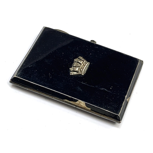 123 - An early 20th century navy blue enamelled silver ladies cigarette case with Royal Navy crown to lid,... 