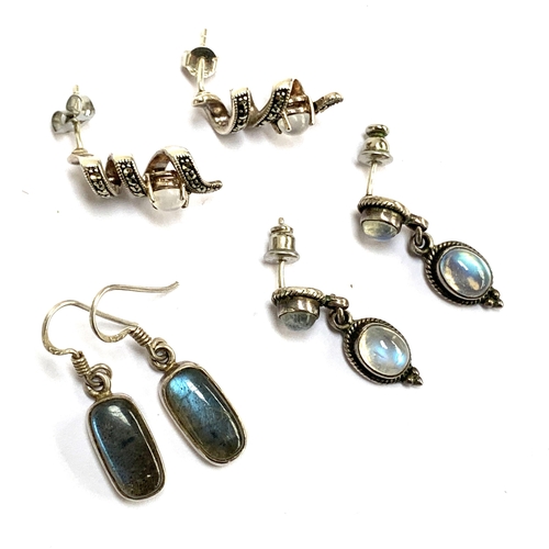 23 - A pair of 925 silver drop earrings set with moonstones, 2.8cmL, 4.7g; together with further pair of ... 