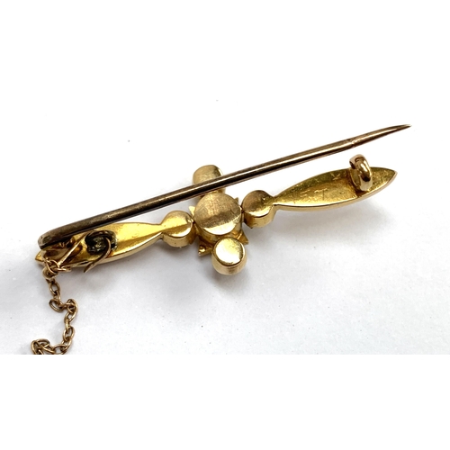 38 - A 15ct gold bar brooch set with pearls and a central sapphire, 4.2cmL, 4.7g