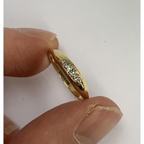 44 - An early 20th century 18ct gold ring set with three old cut diamonds, size M, 2.9g