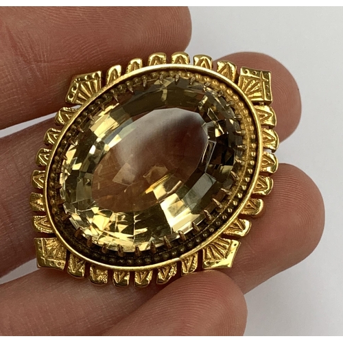 47 - An impressive 9ct gold mounted citrine brooch, the large citrine 2.8x2cm, hallmarked for H&SL,  Lond... 