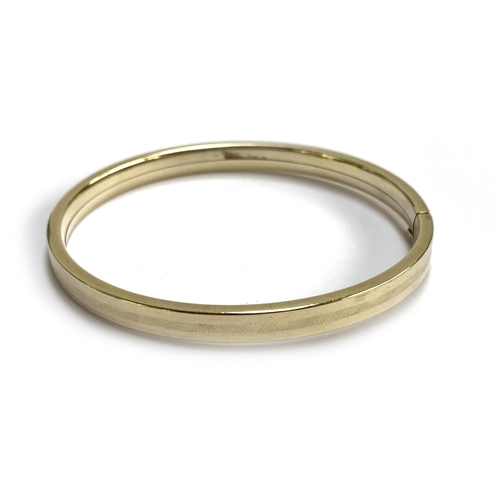 53 - A yellow metal bangle, 6.5cmW, 16g