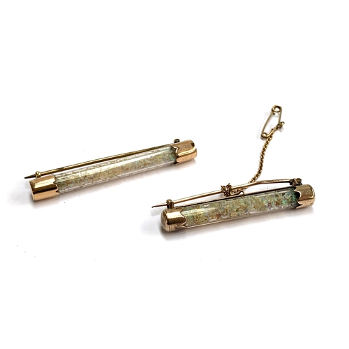 54 - Two late Victorian gold mounted glass tube brooches containing Australian opal chips, 5.2 and 4.4cm ... 