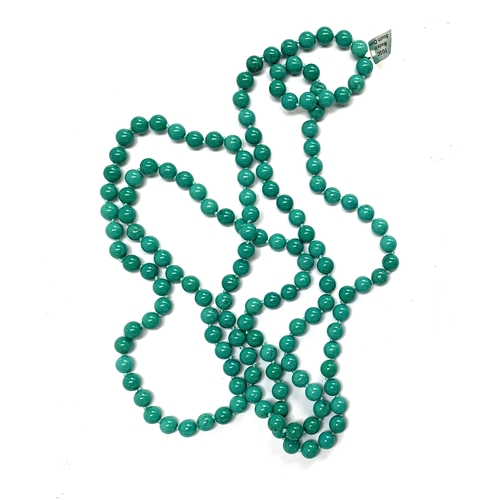 87 - A very long turquoise bead necklace, approx. 981cts of Chinese turquoise, each bead 13mmD, 80cmL