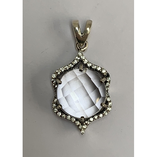 89 - A silver pendant set with a Golconda quartz and natural white zircons, the checkerboard cut Indian q... 