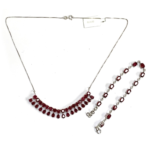 91 - A sterling silver and ruby fringe necklace, the madagascan rubies totalling 22.8cts; together with a... 