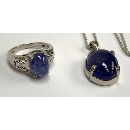 94 - A sterling silver ring set with a tanzanite cabochon, 3.6cts, size K, 3.3g; together a similar silve... 