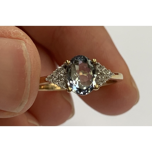 95 - A 9ct gold ring set with a bicolour tanzanite and natural white zircons, size S, 2.4g