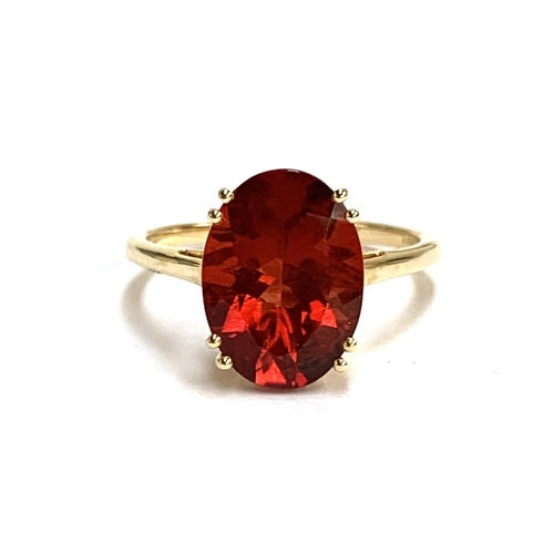 66 - A 14ct gold and red andesine ring, the Tarocco red andesine 4.3cts and 14x10mm, size S, 3.6g