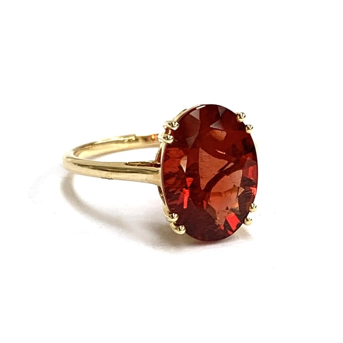 66 - A 14ct gold and red andesine ring, the Tarocco red andesine 4.3cts and 14x10mm, size S, 3.6g